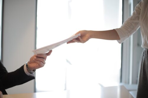 Person handing unemployment documents